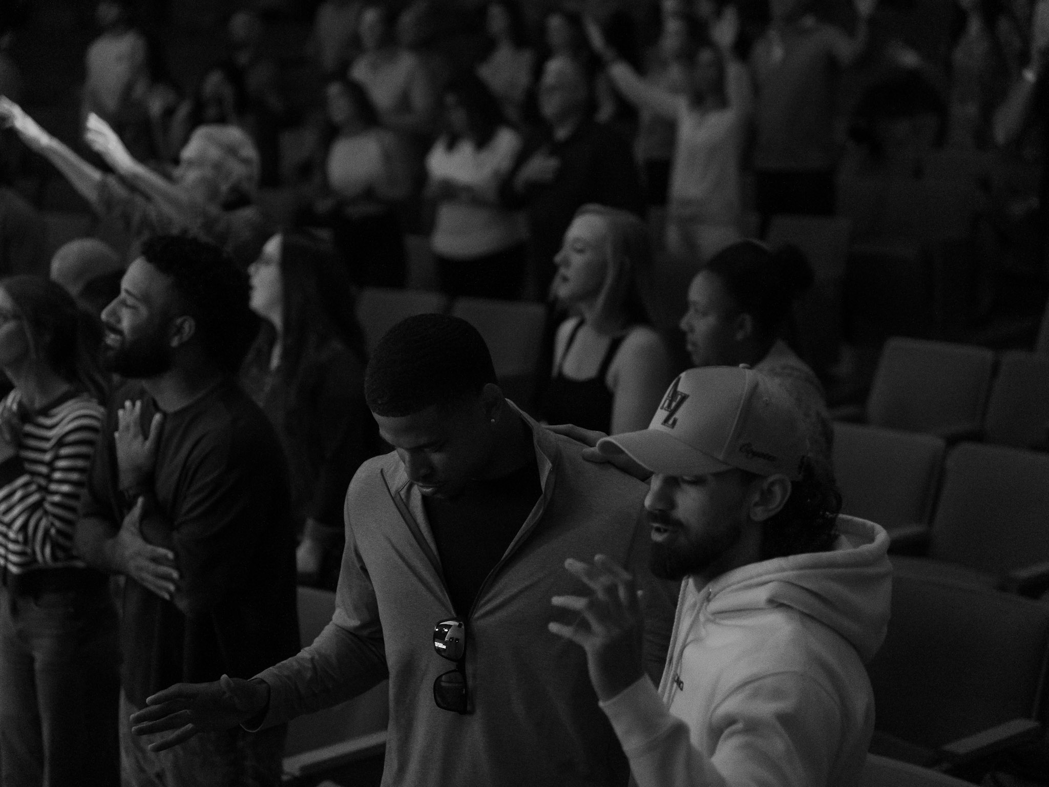 Men praying together at Legacy Church